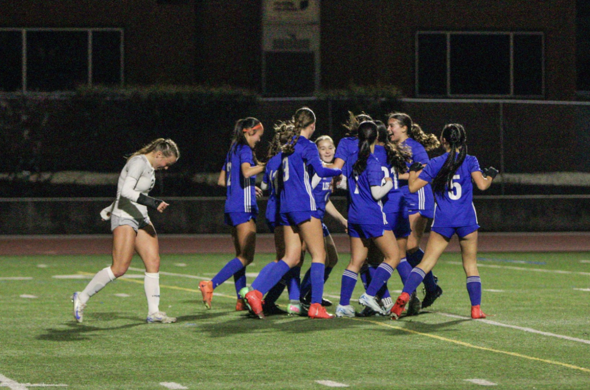 The Eagles celebrate after scoring their first goal against Homestead this season — after losing their last game to the Mustangs without scoring a goal. 
